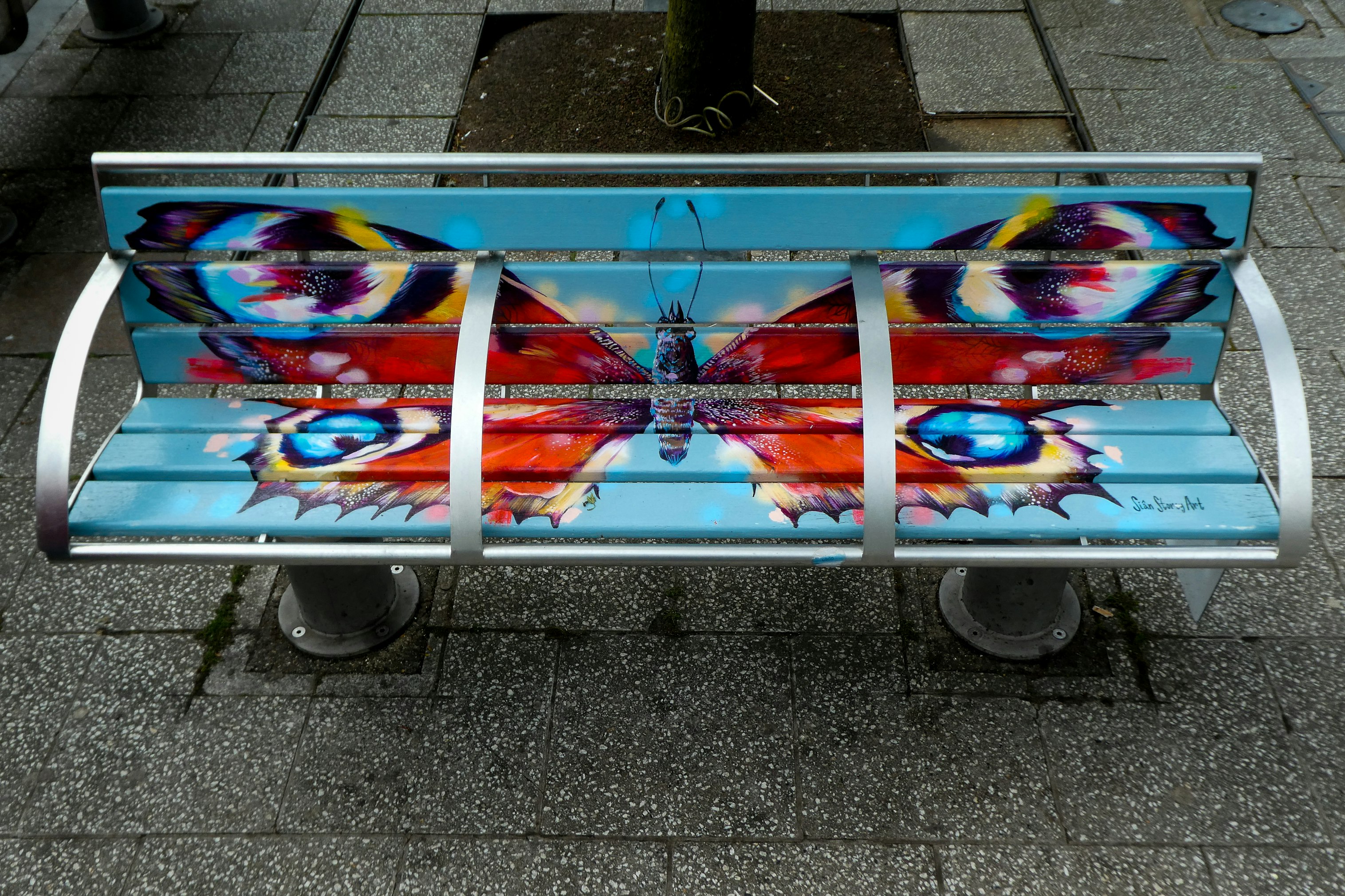 multi color skateboard on gray metal frame